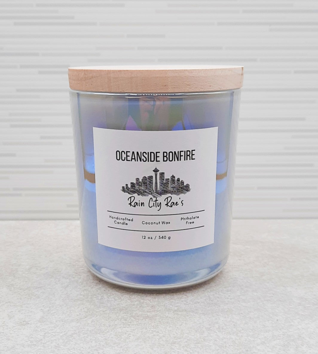 Oceanside Bonfire 13 oz iridescent candle with natural thick maple wood lid